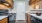 a kitchen with wooden cabinets