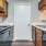 a kitchen with wooden cabinets