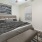 a bedroom with a ceiling fan