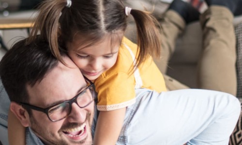 a man and child playing