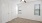 a room with a ceiling fan and a door