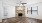 a room with a fireplace and a wood floor