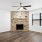 a room with a fireplace and a wood floor
