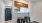 a kitchen with stools and a table