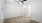 a room with a ceiling fan and a door